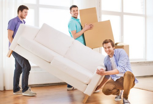 Moving van and packed boxes during house removals in Westkensington