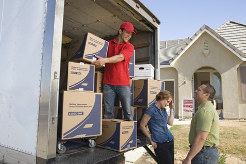 Packed boxes and furniture loaded into a removal van