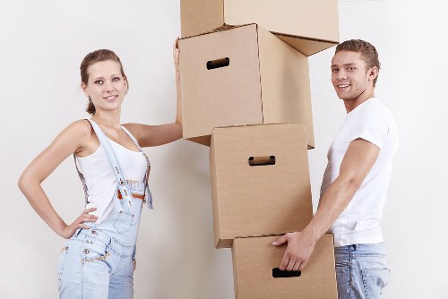 Professional movers transporting boxes in West Kensington