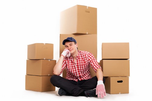 Professional movers preparing items for transport in West Kensington