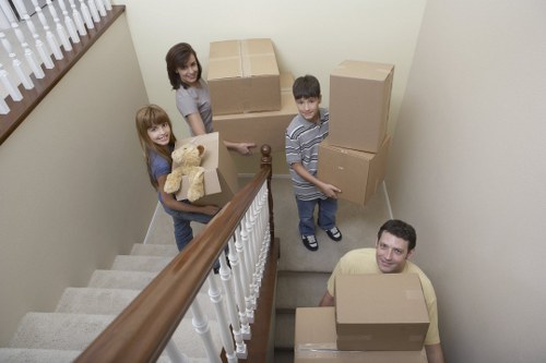 Removal workers loading boxes for a Westkensington relocation